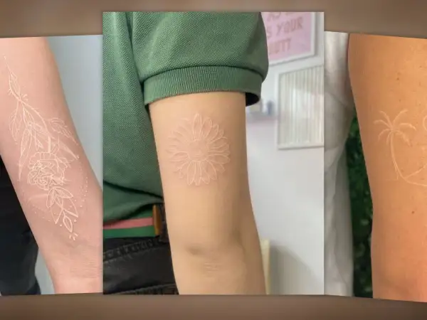 Drei Arme mit filigranen weißen Tattoos: eine Rose mit Blättern, eine Gänseblümchen und eine Palme.